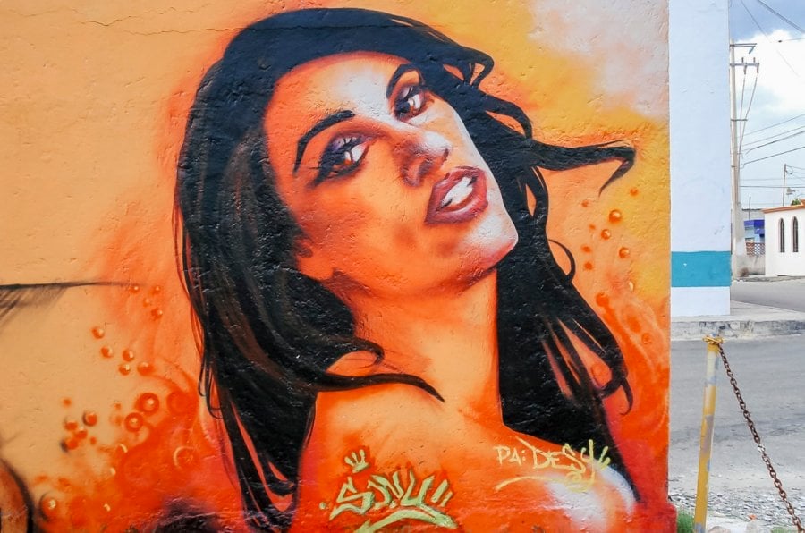 A mural of a brunette woman by street artist Sony Montana in Cancun