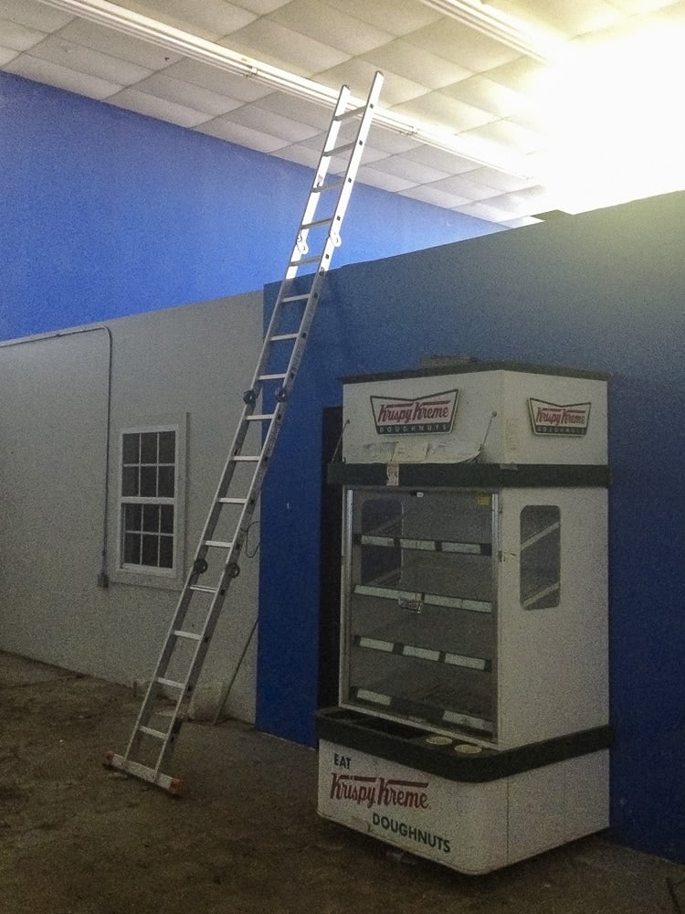 Ladder and a Krispy Kreme display in an abandoned Dance Studio  