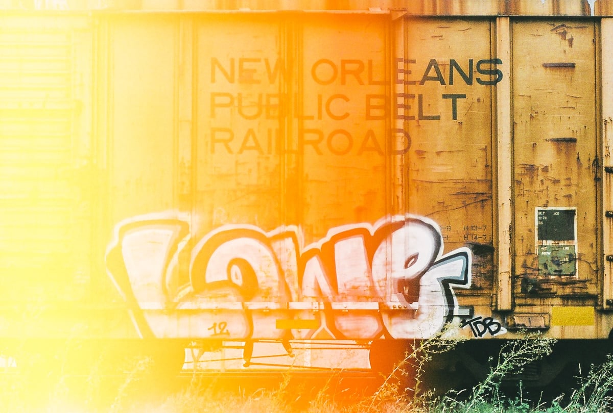 Light leak in a photo of graffiti on an abandoned boxcar