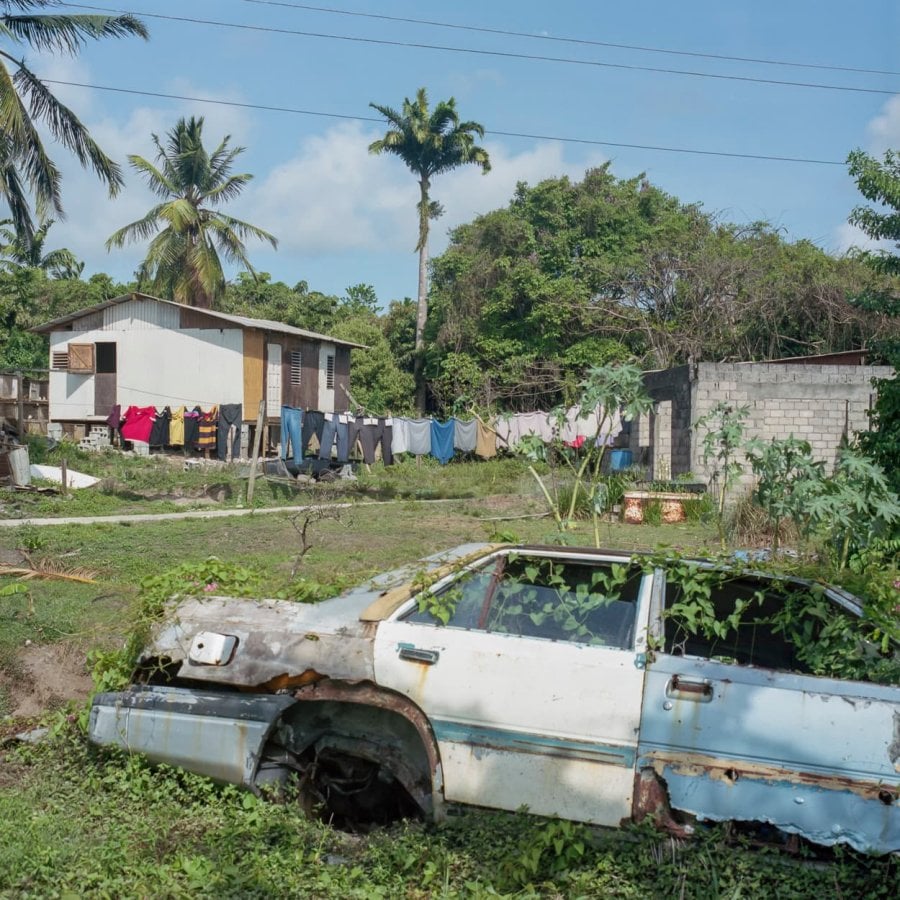 An abandoned car in a village in St. Lucia