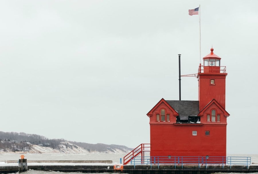 Big Red Lighthouse covered with snow in Holland, Michigan