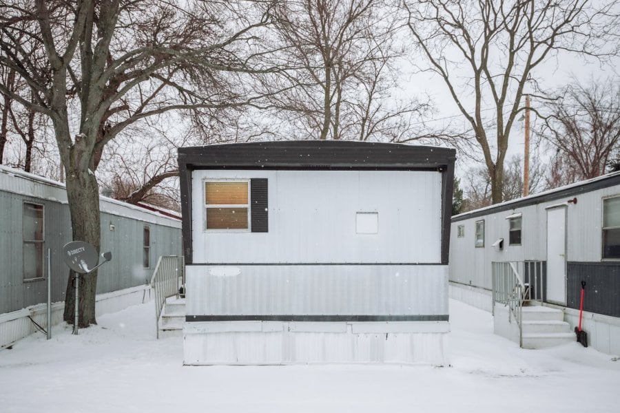 A mobile home in a trailer  park covered with snow in Holland, Michigan