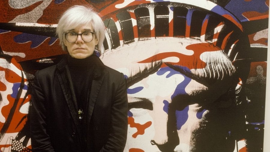 Andy Warhol paints the Statue of Liberty in Paris, France in 1986. Photograph: Francois Lochon/Gamma-Rapho via Getty