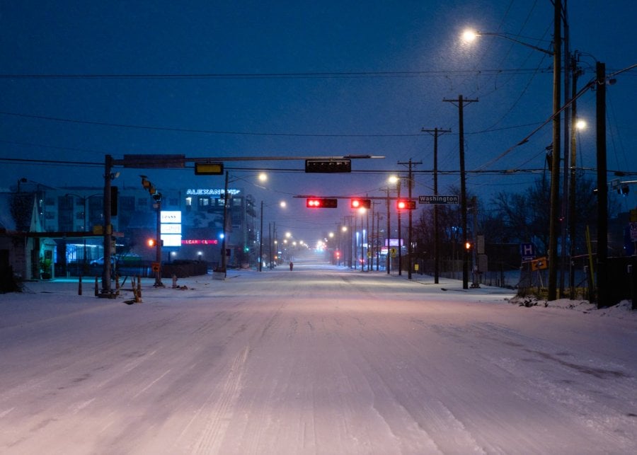 Ross Avenue in Dallas covered with snow at night