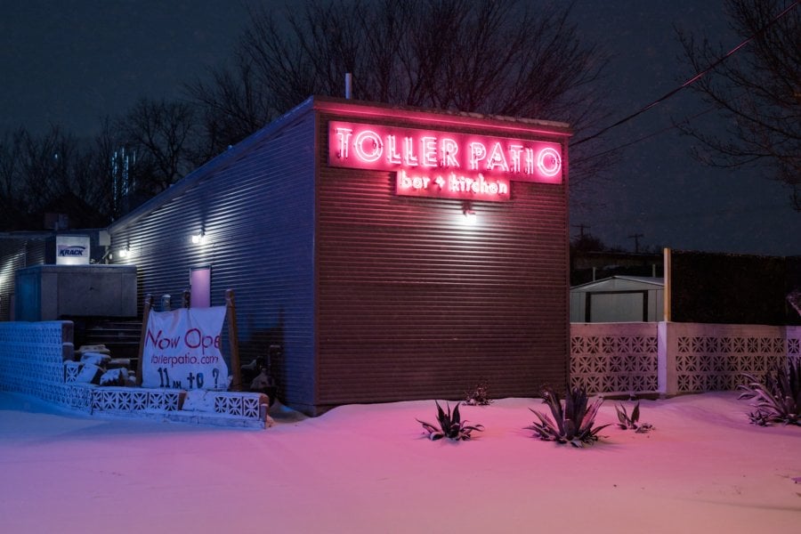 Toller Patio bar with their pink neon sign in the snow