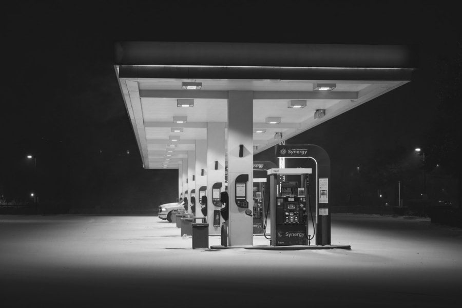 75 and Lesson 7-11 gas station at night