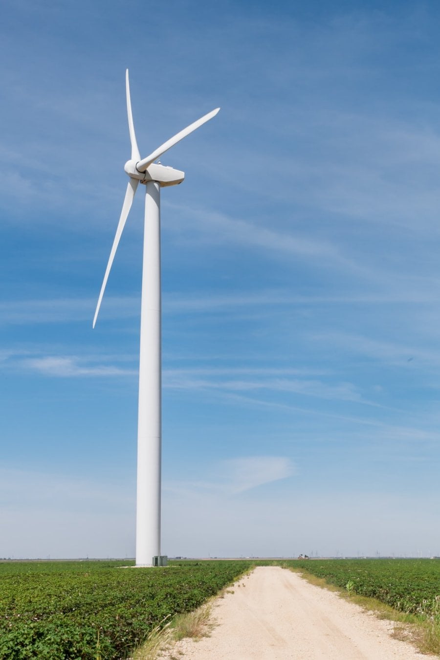 A wind turbine on a dirt road at the Roscoe Wind Farm