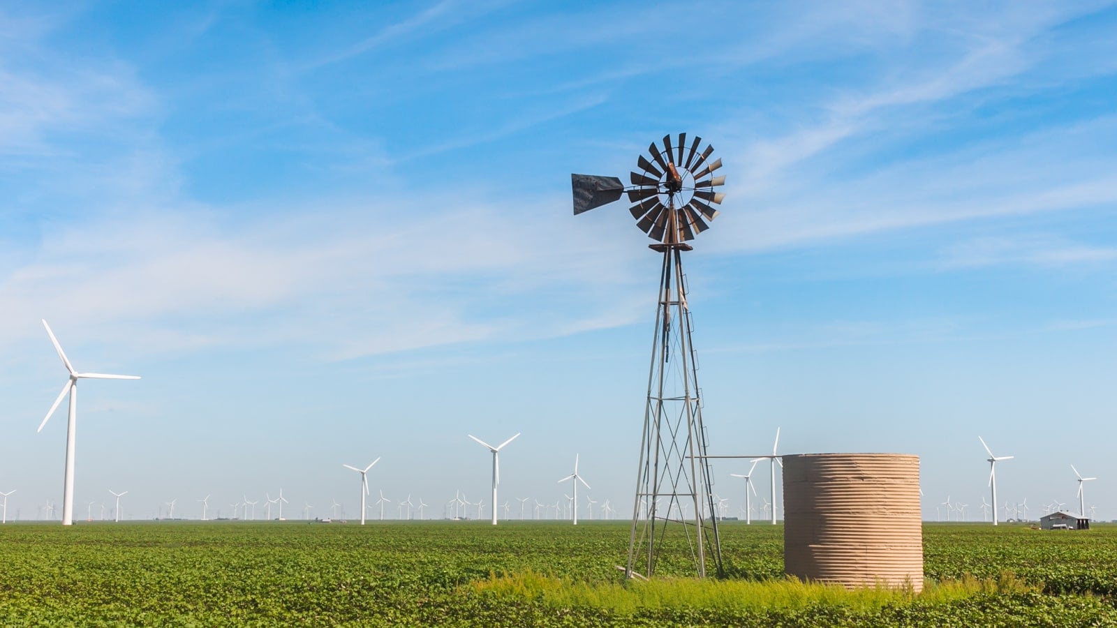 Old windmill with wind turbines