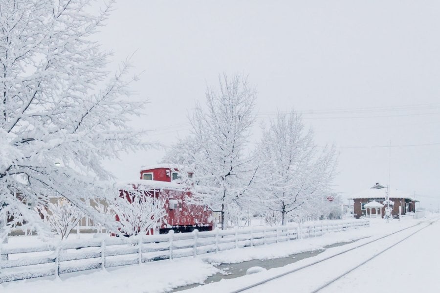 Red train caboose in Wills Point snow