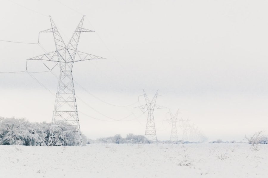 Transmission towers and power cables in snow