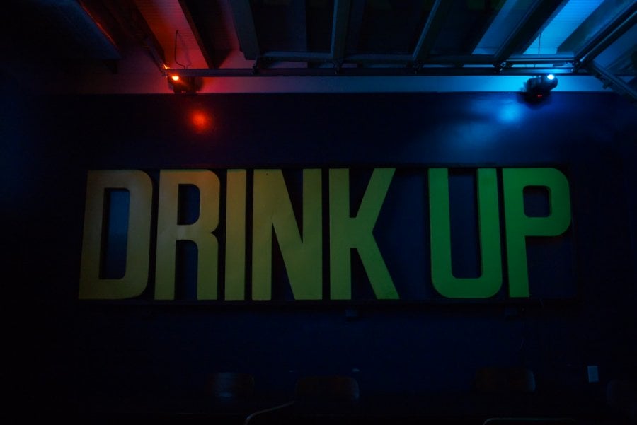 Drink Up sign in a bar