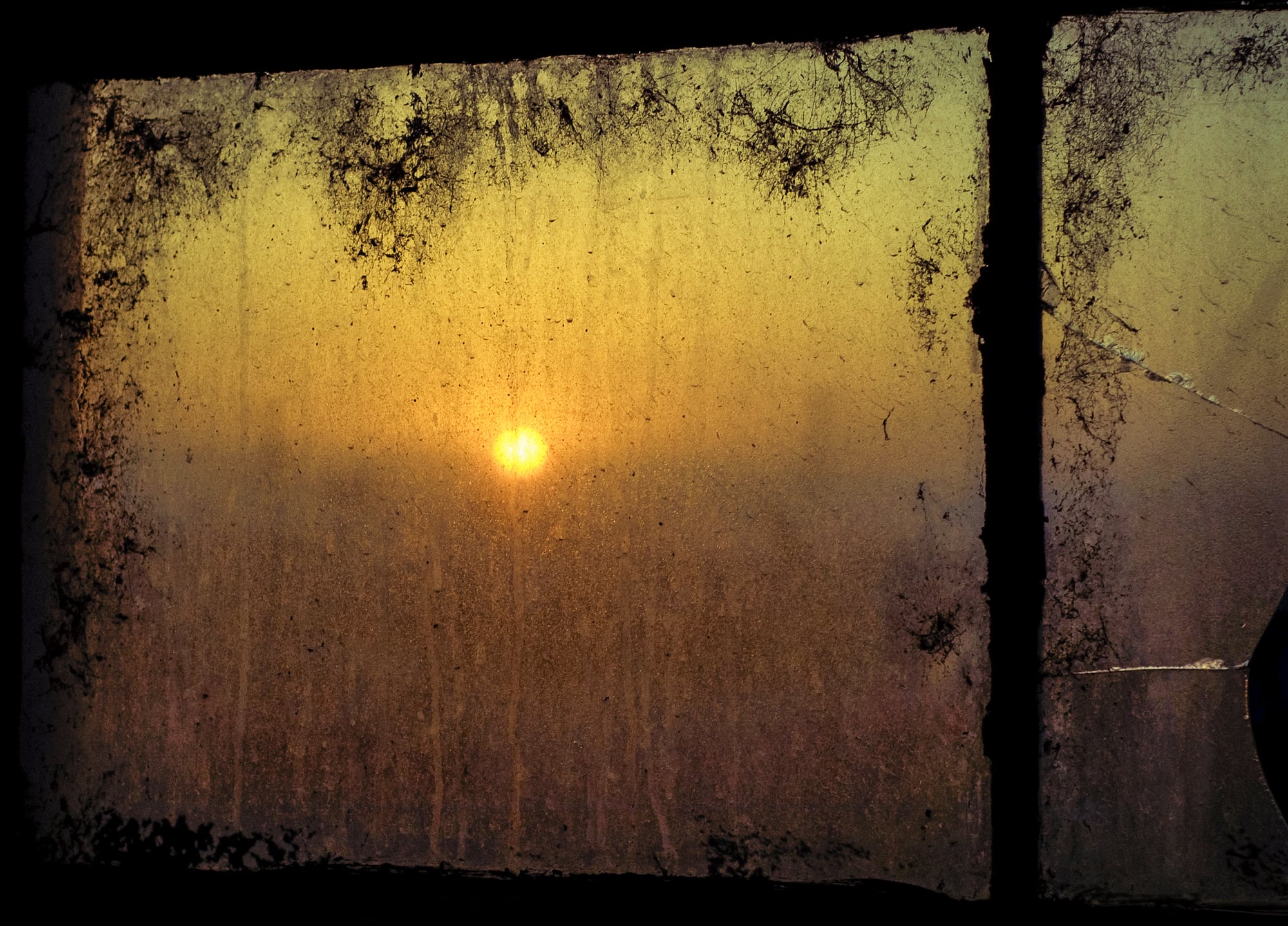 Sunrise through and dirty window