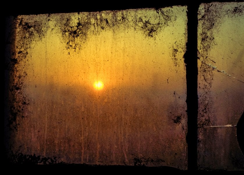 Sunrise through and dirty window
