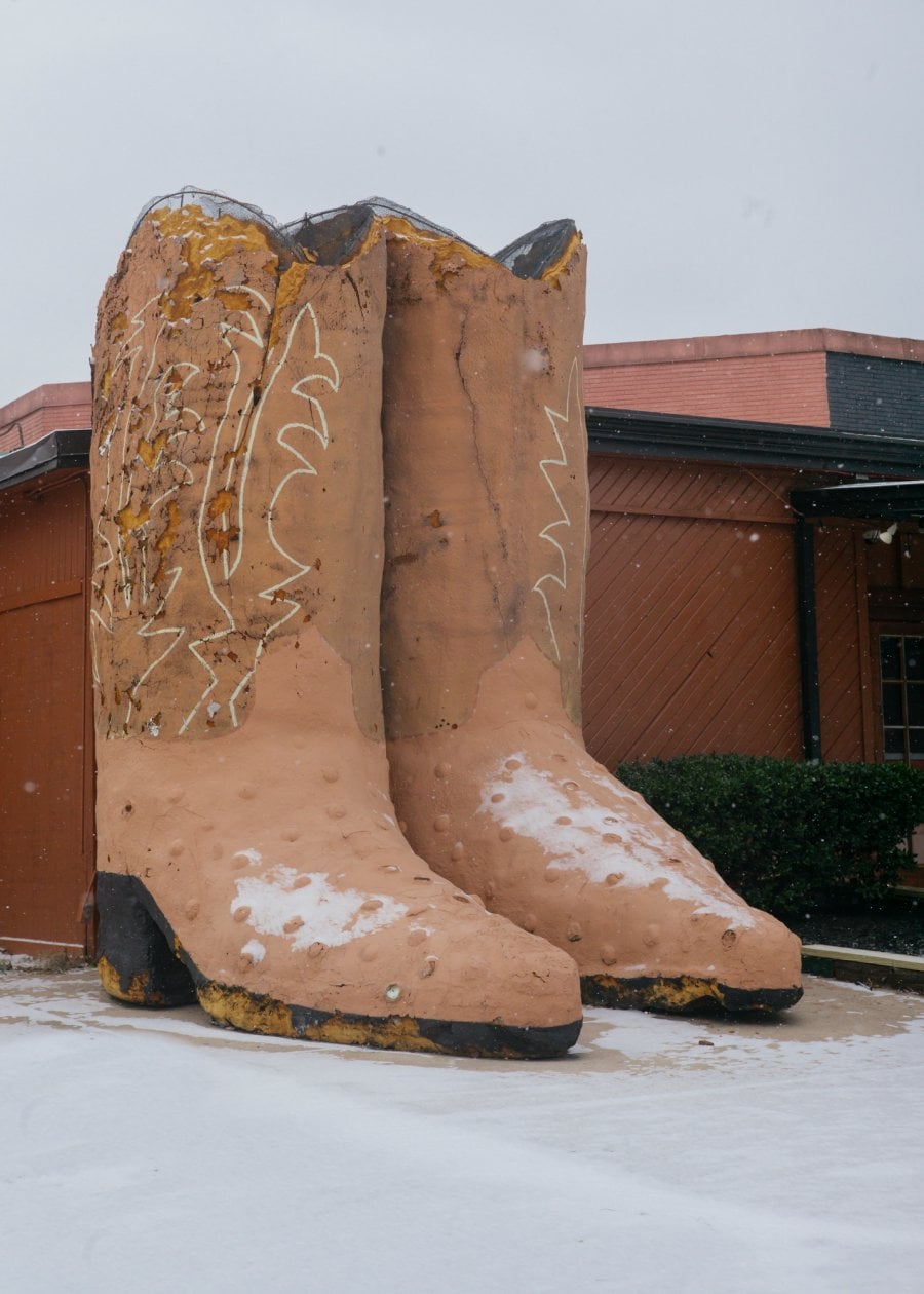 Large cowboy boots in the snow