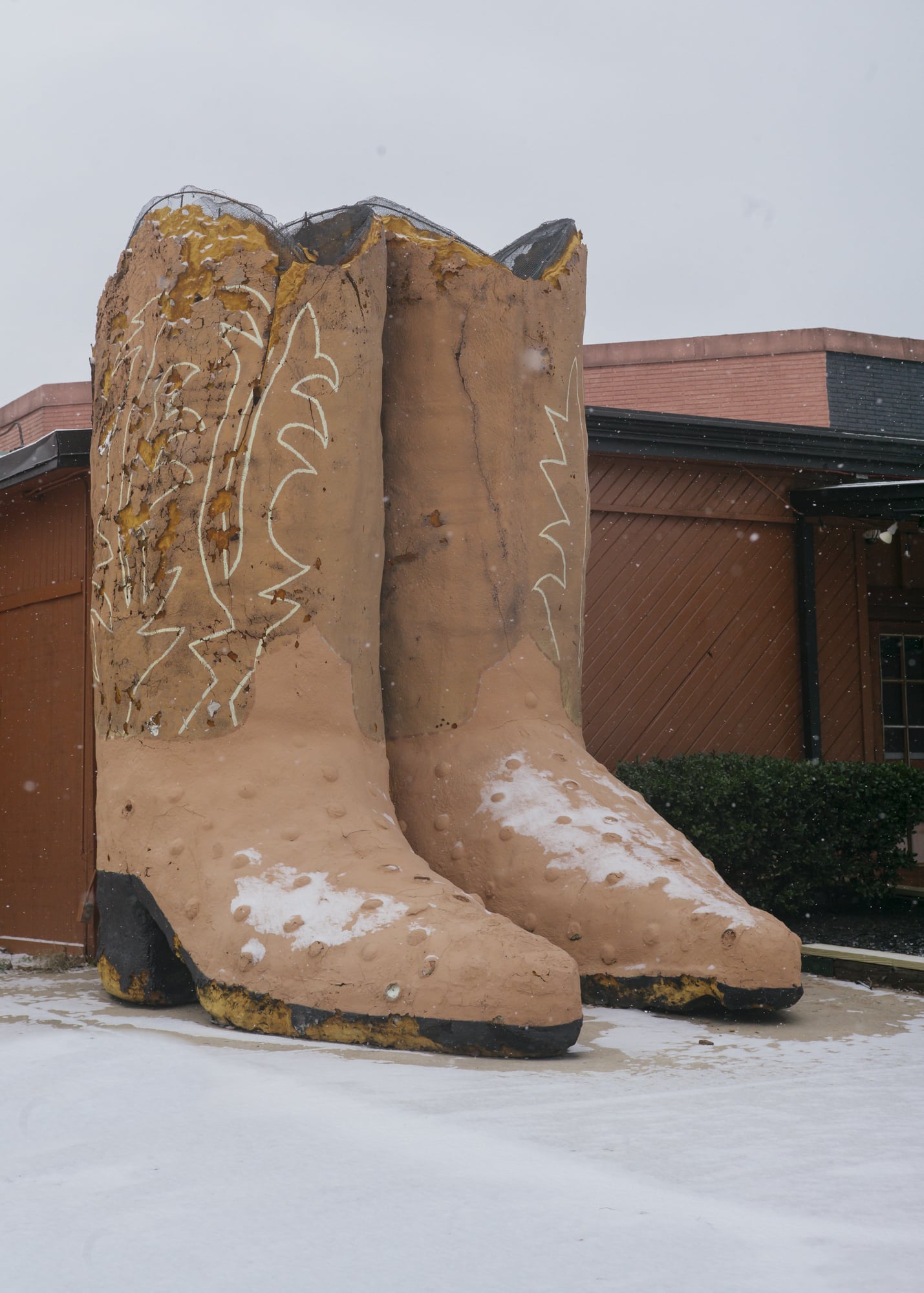 Large cowboy boots in the snow