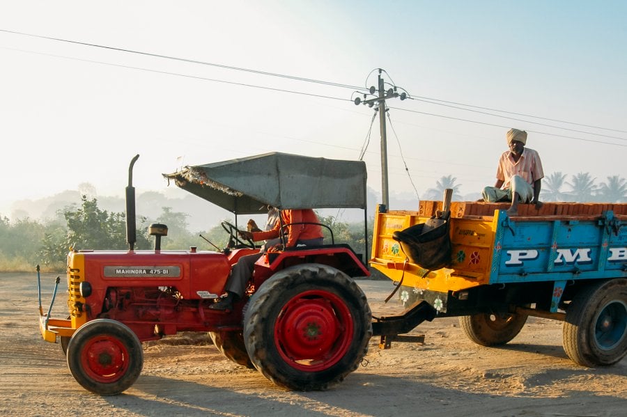 A farmer and tractor in Hosur, India