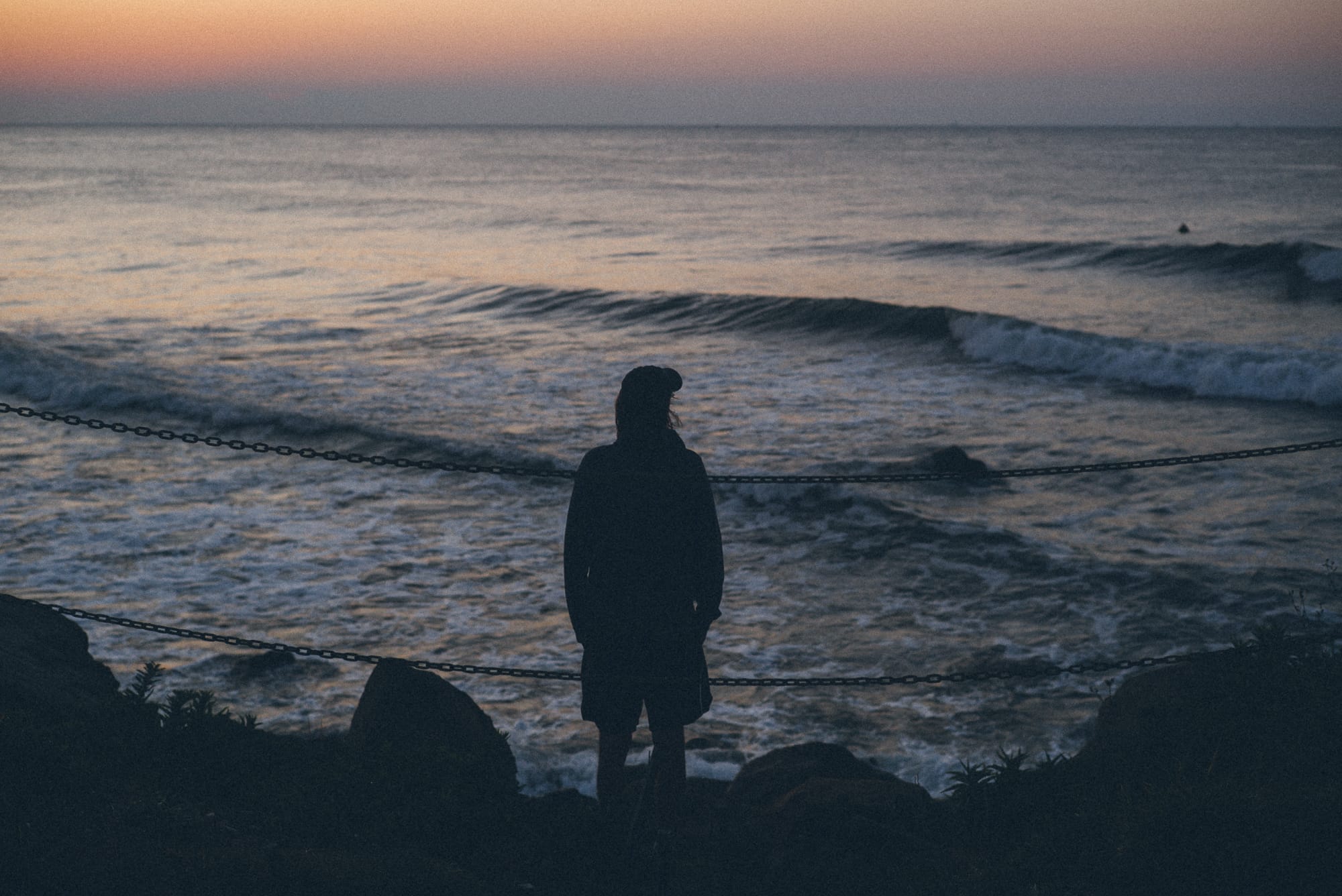 Silhouette of man at Point Judith, Narragansett during sunrise