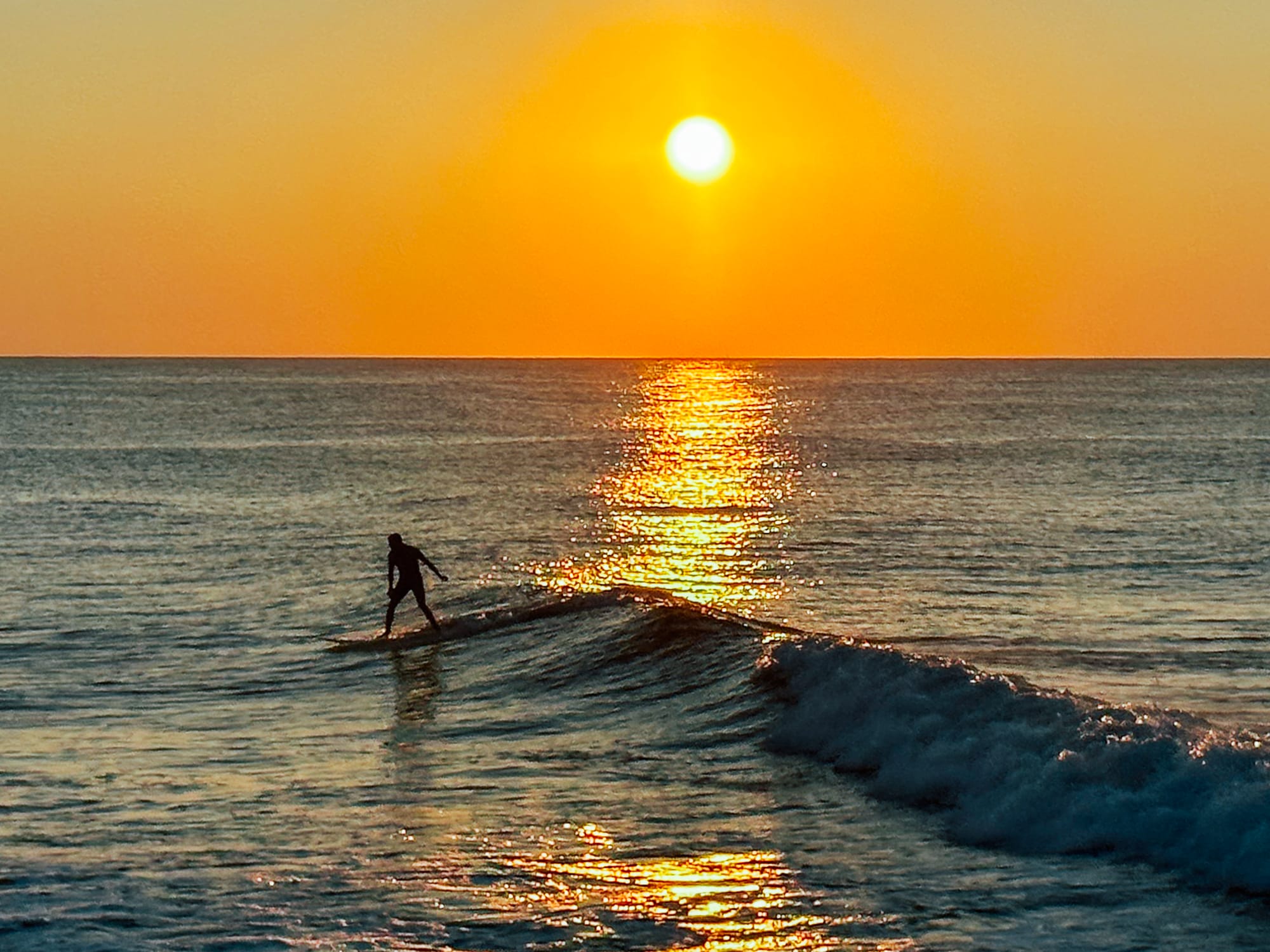 surfer at Point Judith, Narragansett, Rhode Island during sunrise